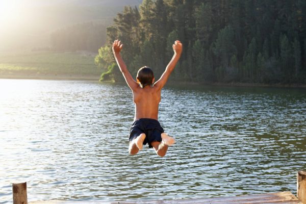 young-boy-jumping-into-lake.jpg